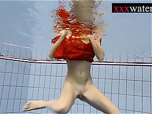 sexy steaming female swimming in the pool